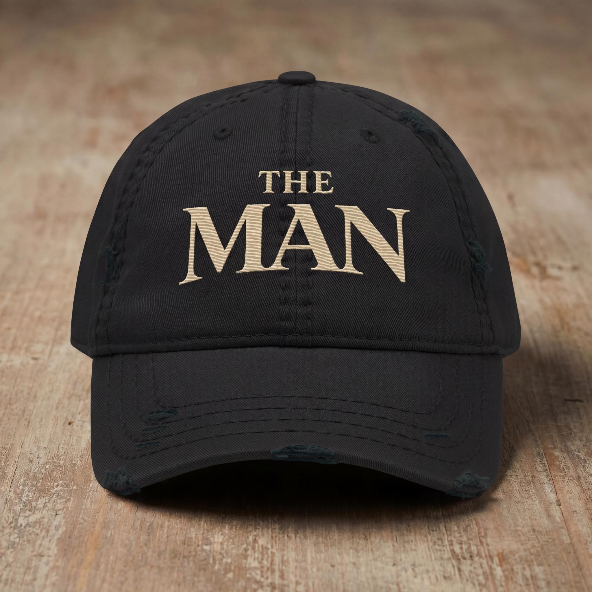 Black THE MAN embroidered hat from the Atlas Stitch Father Capsule.