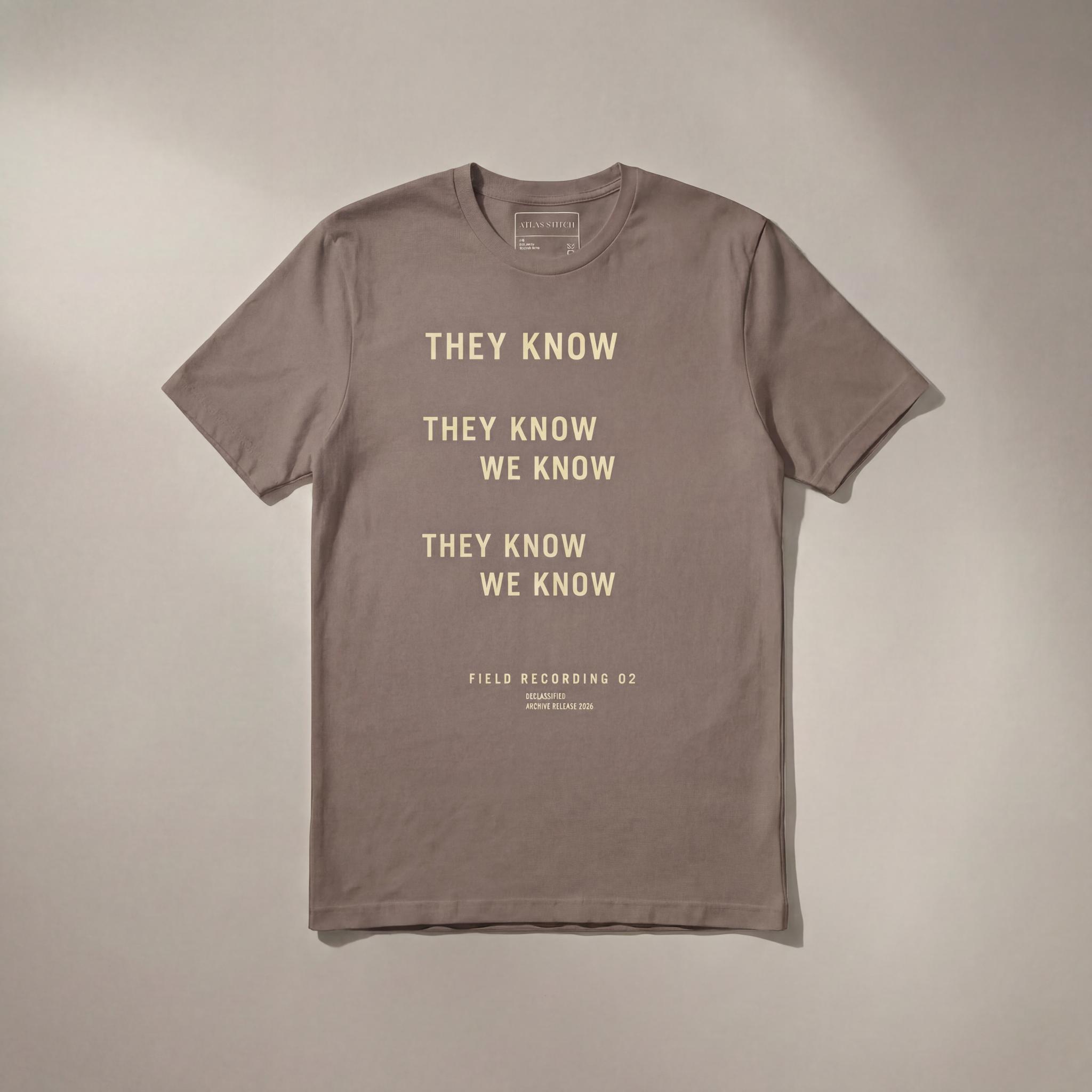 PebbleTee They Know We Know graphic tee with front design visible.
