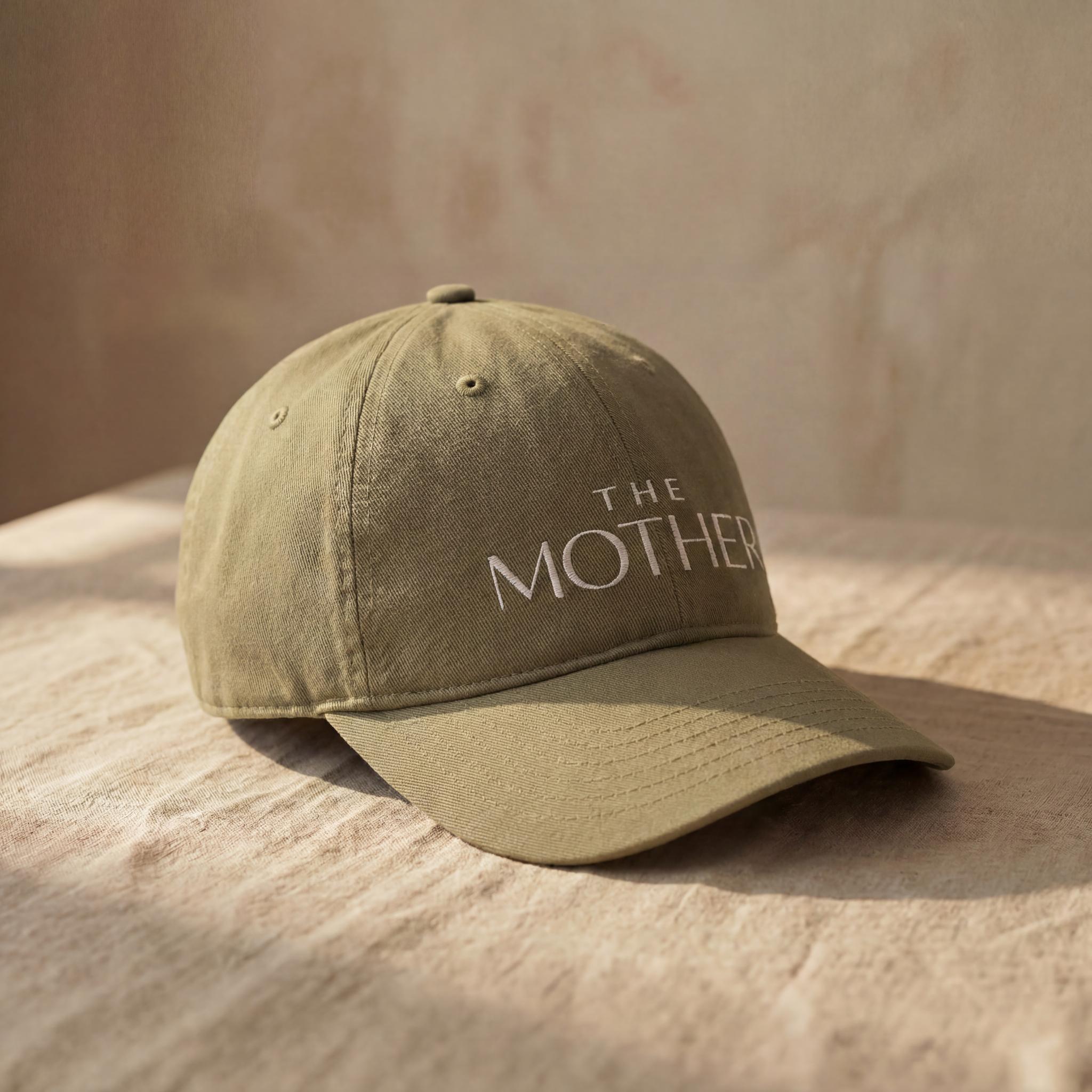 Olive MOTHER embroidered cap shown from a side angle.