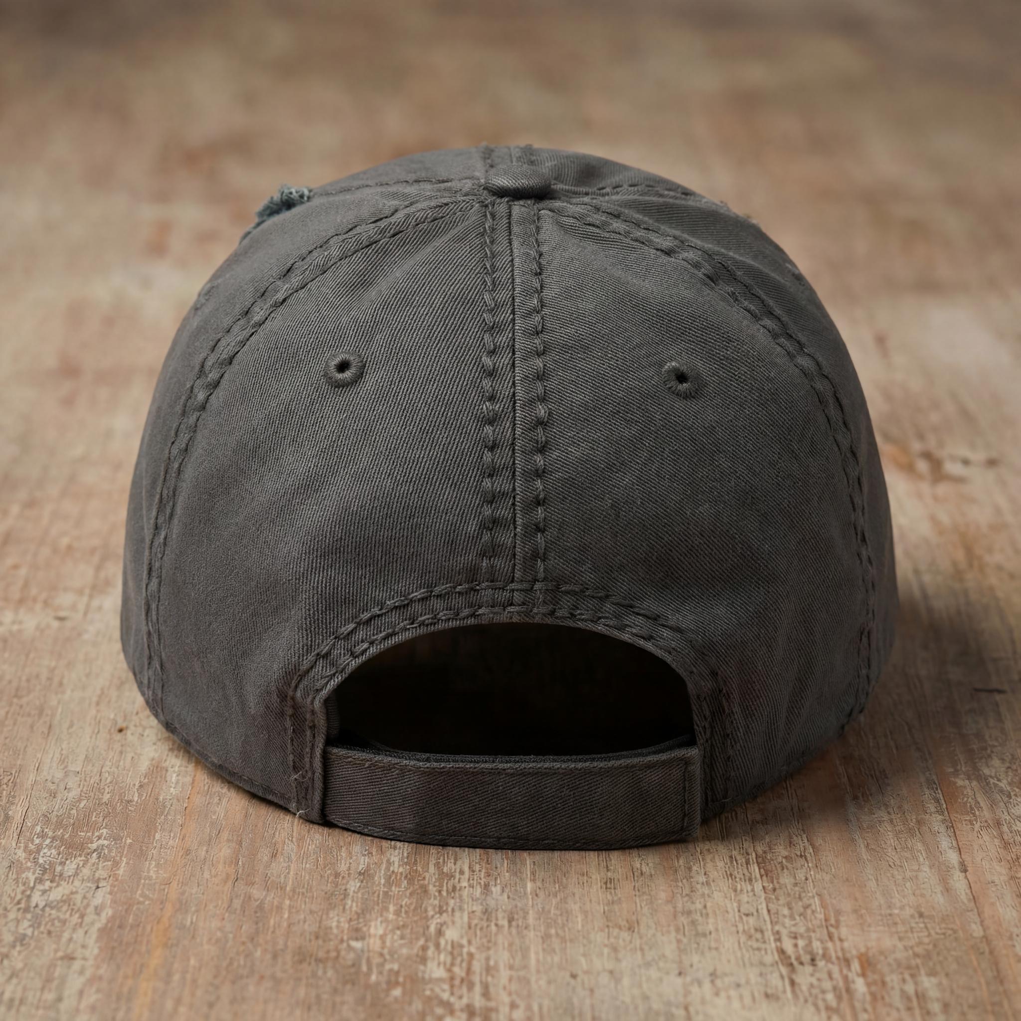 Charcoal THE MAN embroidered hat with adjustable back strap visible.