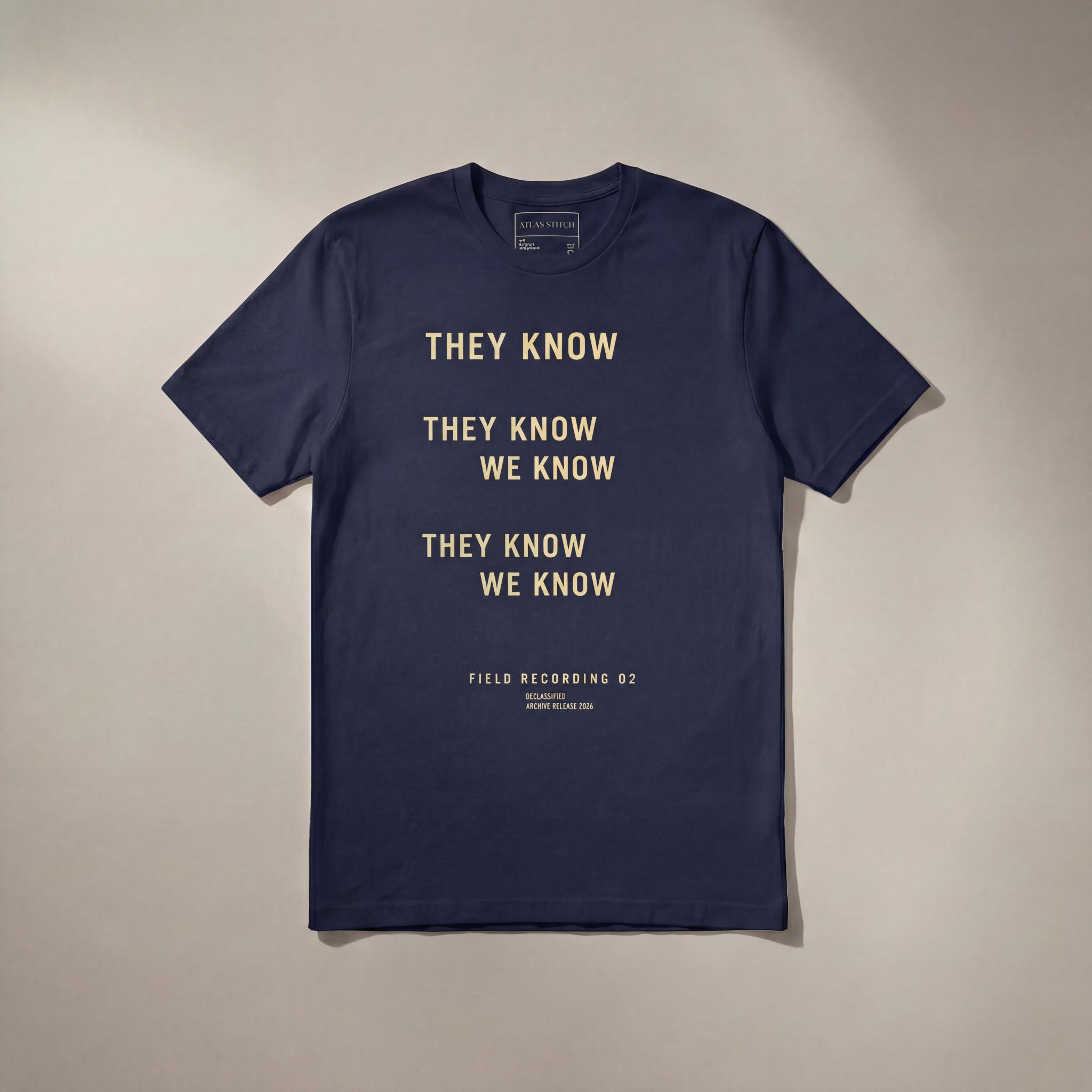 Navy They Know We Know graphic tee with front design visible.